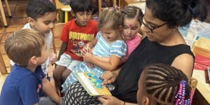 Montessori students with teacher